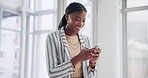 Scroll, business and black woman with smartphone in office for social media, networking or communication. Professional, corporate and happy female consultant for texting, email or browsing internet