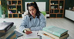 Homework, student and girl with smartphone, bored and exhausted with burnout, distracted and fatigue. Apartment, person or woman with books, tired or cellphone with education, study or procrastinate