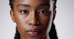 Skincare, serious and face of black woman in studio with natural, beauty and cosmetic routine. Wellness, portrait and African female person with facial dermatology treatment by gray background.