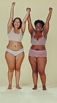 Body positive, diversity and women holding hands, celebrate and excited support, natural beauty or inclusion. Woman empowerment portrait, shape and underwear friends celebration on studio background