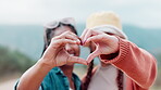 Friends, hands and happy heart in nature, bonding and smile  or cheerful and care on vacation or holiday. People, summer and travelling for fun, laughing and together or support with gen z for break