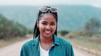 Outdoor, road and face of woman with smile in nature for adventure, travel and vacation at countryside. Person, relax and happy with sunglasses in pride for holiday, journey or tourism in New Zealand