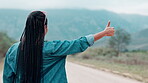 Woman ,hitchhiker and nature or back and road, transport and help or assistance with gesture for roadside or car stop.  Outdoor, female person and traveller and adventure in countryside for lift