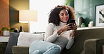 Woman, home and smile on sofa with smartphone on social media or online dating for networking or fun. Female person, living room and internet or mobile app for entertainment, communication and post