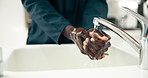 Black man, hands and washing with water by sink for hygiene, disinfection or sanitizing in bathroom. Closeup of African, male person or janitor cleaning for dirt, bacteria or germ removal by faucet