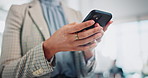 Business woman, hands and typing with phone for communication, research or browsing at office. Closeup of female person or employee on mobile smartphone for online chat, texting or app at workplace
