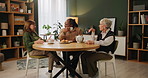 Tea, support and senior women in a house with care, trust and conversation, relax and bonding together. Talking, retirement and group of elderly friends at home with drinks, chat or gossip at reunion