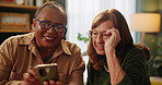 Phone, search and senior women with glasses in house reading social media, joke or funny reel and comic gif. Smartphone, help or friends showing how to, sign up or subscription service while bonding