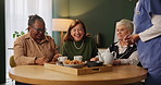 Nursing home, elderly women and friends with morning tea, bonding together and food with coffee break. Old people, group and pensioner with caregiver, meal and ginger drink in living room and talking