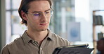 Man, working and typing on tablet in office, networking and company website or review online business proposal. Reading, email and social media for communication, search with satisfied employee