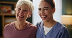 Senior woman, nurse and hug with smile, face and laughing for service, support and kindness in living room. Caregiver, elderly patient and people with embrace, connection and portrait in nursing home