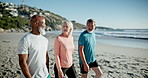 Senior friends, walk and exercise at beach with chat, support and diversity with training in summer. Men, woman and group in conversation for health, solidarity and workout in fitness club by ocean