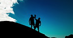 People, holding hands and fitness on rocks for winning with help by blue sky, clouds and outdoor. Men, support and lift for partnership, silhouette or goal in training, exercise and workout in summer