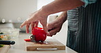 Hands, cutting and cooking with home, kitchen and preparation for food or nutrition with diet. Person, vegetables and red peppers for lunch, dinner or meal with pan and ingredients for chopping board