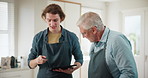 Cooking, tablet and senior man with son in kitchen for online recipe, instructions and teamwork. Apron, nutrition and family with connection for ingredients, steps and preparing dinner in home