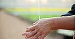 Agriculture, farming and person with washing hands by water for hygiene, safety or removal of dirt. Eco friendly, greenhouse and liquid with cleaning for bacteria, health or sustainability in Denmark