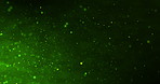 Digital, animation and green bokeh background for internet, fiber optic and futuristic technology in dark. Sparkle, glitter and light flow with data nodes or particles of network and textures or glow