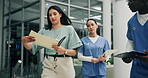 Medical staff, emergency and teamwork with paperwork in hospital for healthcare as professional in ER. Doctor, nurse and rushing in collaboration for crisis or alert for surgery in clinic with record