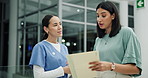 Doctor, nurse and women with documents in lobby, hospital and discussion with report for healthcare. People, medical staff and paperwork with conversation, advice or feedback with teamwork in clinic