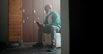 Notification, smartphone and black man in locker room reading message for online news or blog. Mature male person, mobile tech and text in dressing area for retirement communication and internet info