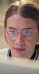 Glasses, computer and face of woman programming for coding, reading or work on software project email in startup. Reflection, web designer or closeup of person on pc for information technology online