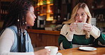 Women, espresso and conversation in cafe as friends with chat, happy and gossip news for coffee connect. Girls, tea and communication in New York restaurant in morning for social, relax and talking