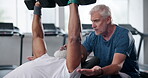 Gym, dumbbells and man with personal trainer, bodybuilder and wellness for body and healthy. Workout, exercise and mature people in club with equipment, training and fitness, motivation and muscle