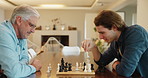 Chess, senior father and adult son with fun, playful and bonding together with happiness, weekend break and chilling. Chatting, board game and relax with family, elderly man and people with hobby