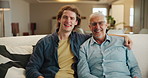Senior dad, son and portrait on sofa for support, embrace and happy bonding together in home. Relax, father and adult child hug on couch with respect, care and smile on face on weekend in living room