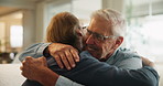 Senior father, son and hug on sofa for support, love and happy bonding together in home. Relax, dad and adult child embrace on couch with respect, care or comfort on weekend in living room with smile