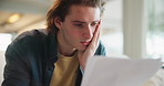 Stress, thinking or man with paper on sofa for finance, budget or review, mistake or disaster at home. Education, documents and student with anxiety overwhelmed by loan rejection, inflation or crisis