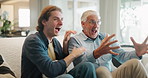 Senior father, son and excited watching tv on sofa for support, sports and happy bonding together in home. Television, dad and adult child on couch with football, soccer ball and cheers on weekend