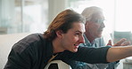 Elderly father, son and watching tv on sofa for support, sports and happy bonding together in home. Television, dad and excited adult child on couch with football, soccer ball and relax on weekend