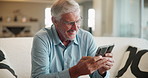 Senior man, home and phone text on sofa with laughing from funny blog and web news in retirement. Morning, mobile and app scroll with technology in a lounge with website search and relax in house