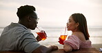 Couple, toast and love on beach with relax on bench for ocean waves, commitment and affection with romantic relationship. Man, woman and together with drink for cheers for anniversary celebration.