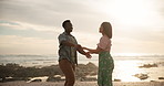 Couple, happy and dancing with love on beach for freedom on romantic holiday, travel and bonding in California. Man, woman and together with movement on vacation by ocean waves, outdoor and sun flare