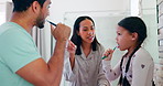 Bathroom, parents and teach a kid about brushing teeth in the morning for healthy habit in home. Child, learning and family with toothbrush for oral care with support for fresh breath and wellness.