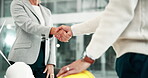 People, architect and handshake in office for agreement, partnership and teamwork or collaboration. Business, employee and meeting for planning or strategy and thank you, workplace and company growth