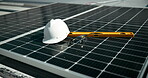 Solar panel, safety and helmet with tools for clean energy, sustainability and go green on rooftop. Technology, equipment and photovoltaic maintenance on building for power, off grid and engineering