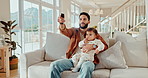 Father, watching tv and baby in a home with cartoon, movie or children film on a living room couch. Family, streaming and series with remote, television and youth education channel on a lounge sofa