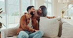 Hug, happy and couple on sofa laughing for bonding, loving relationship and relax together. Marriage, morning and man and woman on couch for conversation, embrace and romance in living room in home