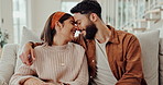 Love, happy and couple on sofa for bonding, loving relationship and relax together in home. Marriage, morning and man and woman on couch with smile, embrace and hugging in living room for affection
