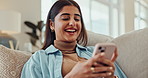 Woman, phone and happy for texting on sofa with notification, reading and contact on mobile app. Girl, person and smartphone for meme, scroll and typing for comic post on social network in apartment
