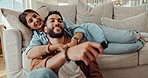 Happy, watching TV and couple on sofa with remote for bonding, relationship and relaxing in living room. Dating, love and man and woman on couch streaming comedy movies, entertainment and series