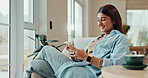 Happy, relax and woman with phone on sofa for online chat, communication and networking. Typing, home and person smile with smartphone for social media, website and internet news in living room
