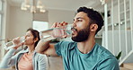 Drinking, water and couple in home after workout for wellness, health and wellbeing for diet. Dating, happy and man and woman with mineral liquid for nutrition after training, exercise and fitness