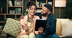 Happy, couple and tablet with conversation on sofa, home and talking or ecommerce or online shopping for purchase. Together, living room and social media browsing, love and relationship people