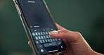 Hand, phone and text message with person typing on keypad for communication or social media. App, contact and mobile with user closeup on dark background for chat, connection or conversation