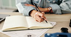 Notebook, writing and hands of business person at desk for planning, schedule and research notes. Professional, brainstorming and closeup of worker with ideas for project, proposal or agenda on paper