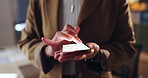 Business person, hands and night with phone screen for communication, social media or research at office. Closeup of employee typing on mobile smartphone display for online browsing, scrolling or app